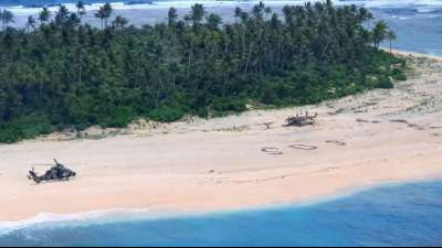 SOS-Zeichen im Sand einer Insel im Westpazifik rettet Seglern das Leben