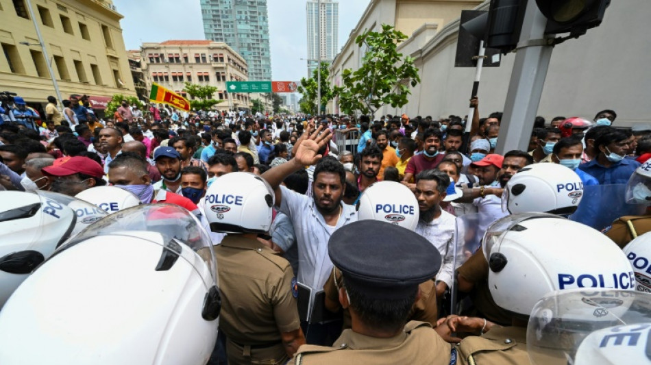 Hundreds defy Sri Lanka curfew after deadly unrest