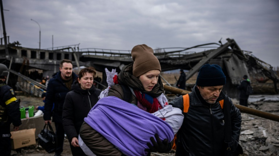 Russia to open Ukraine 'humanitarian routes', but fears persist