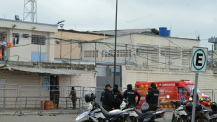 14 killed as rival Ecuadoran inmates fight with guns, explosives