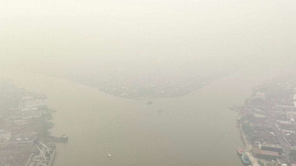 Indonesia escalates battle against fires, putrid haze