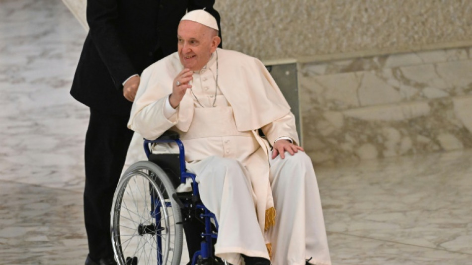 Suffering from knee pain, Pope takes to wheelchair 