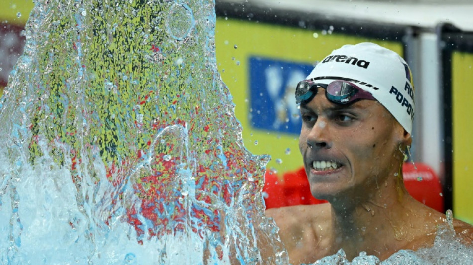 Romanian Popovici, 17, wins men's 200m freestyle world title 