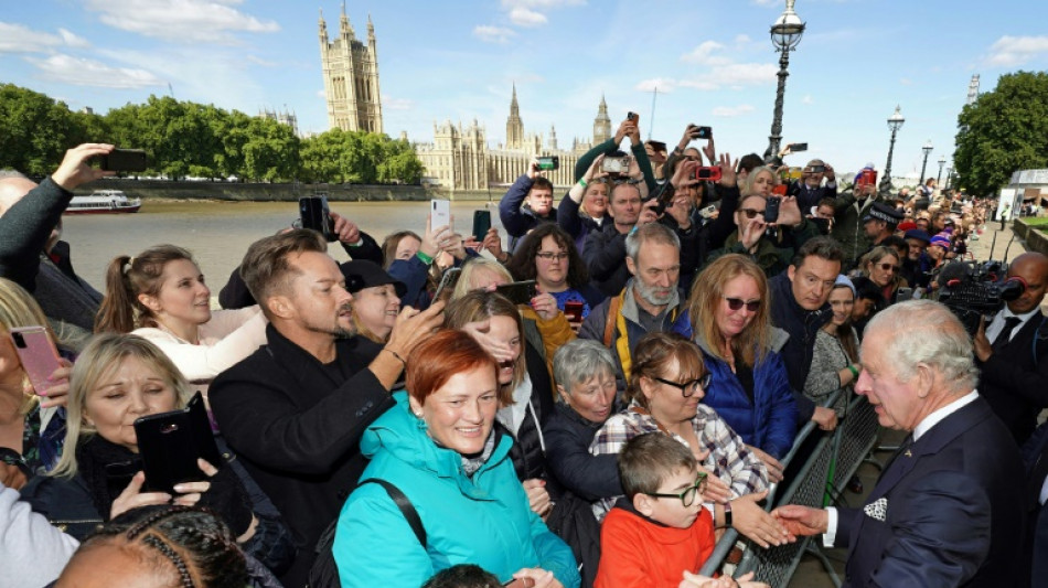 King Charles surprises huge London queue for queen's coffin