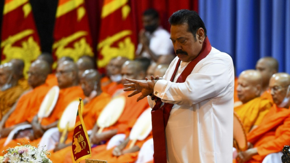 Sri Lanka's ex-PM will not flee country after deadly clashes: son