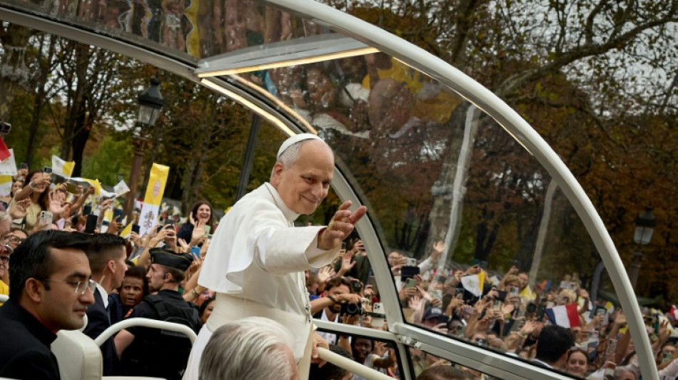 'He said hello': Families pray with pope on Paris avenue