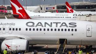 Qantas says profits slump as fuel costs surge