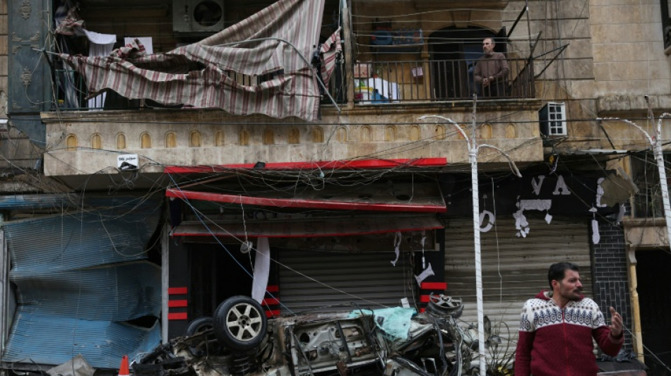Syrians in Kurdish area of Aleppo pick up pieces after clashes