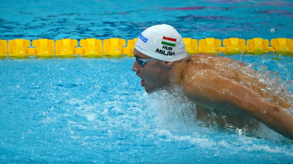 Local star Milak shines but Dressel withdraws from two swimming finals 