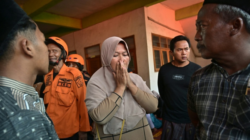 Survivor pulled from Indonesia school collapse as parents await news