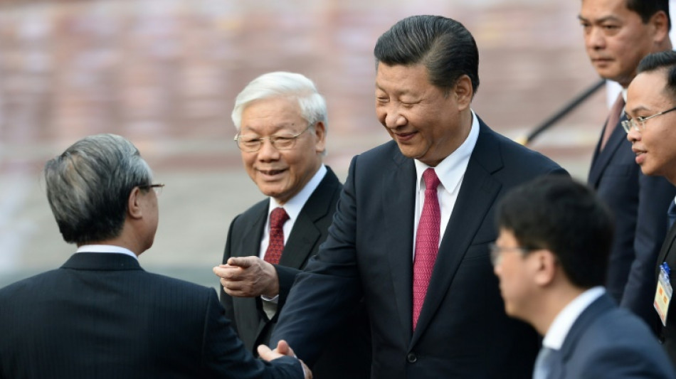 China's Xi looks to strengthen Vietnam ties after Biden visit