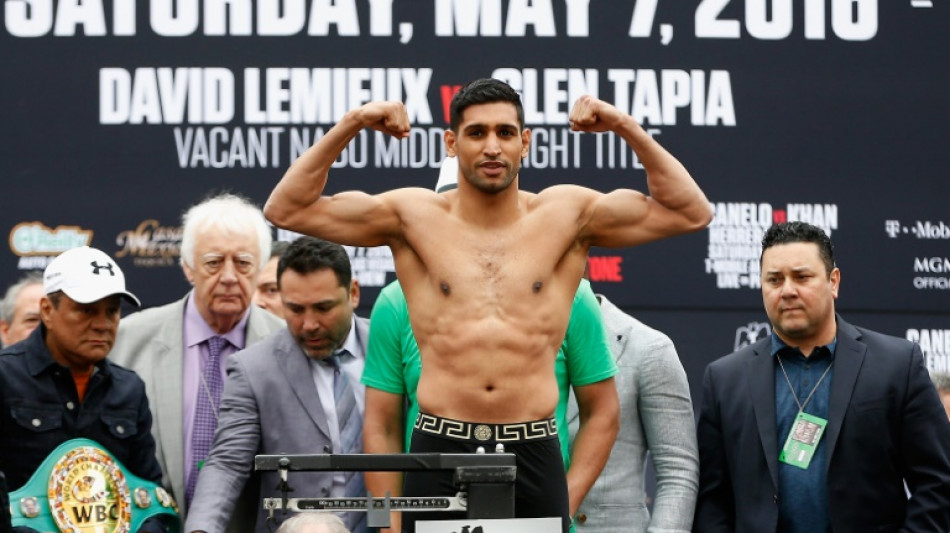 Ex-world champion Amir Khan retires from boxing