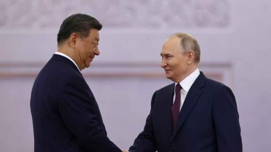 Putin and Xi rail against West as Ukraine reports truce violations