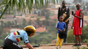 Evenepoel wins third straight time-trial cycling world title

