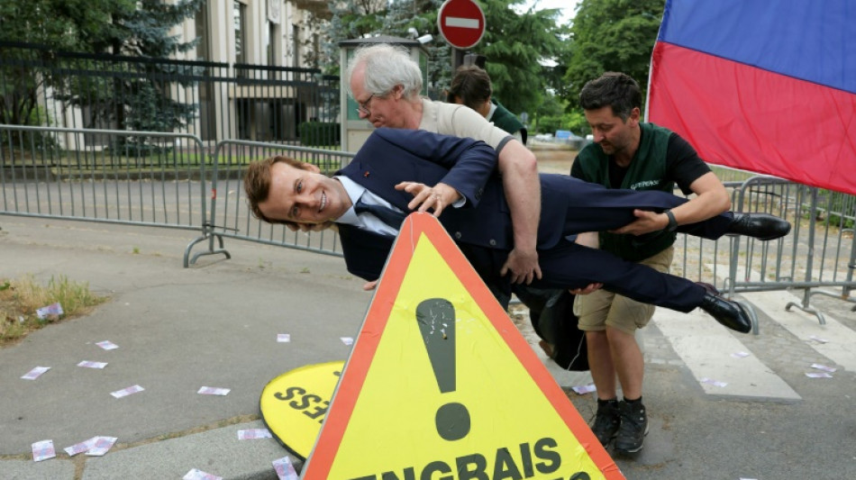 Greenpeace steals Macron wax figure for anti-Russia protest