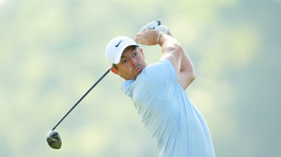 McIlroy shares early lead at emotionally testing PGA Championship