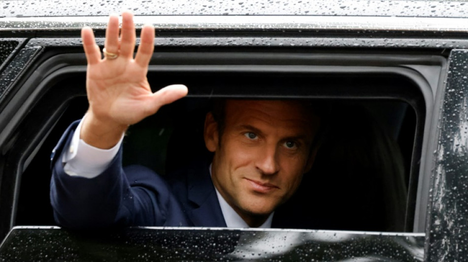 Macron allies seek to salvage power after shock vote setback