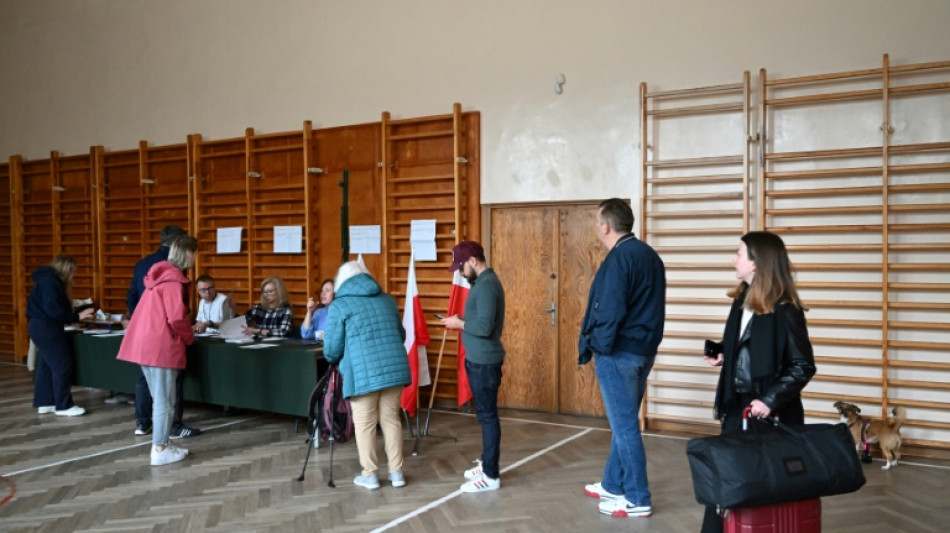 Poland holds tight vote with EU role at stake