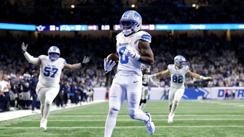 Gibbs runs for three TDs as Lions down Cowboys to boost NFL playoff bid